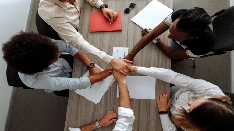 Groups formed through random team assignment collaborating during a classroom or workplace activity
