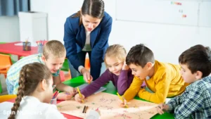 An elementary school teacher guiding young pupils as they play custom board games in the classroom.