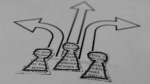 Three paper pawn cutouts facing different drawn directional arrows to represent multi-option scenarios in a Group Decision.