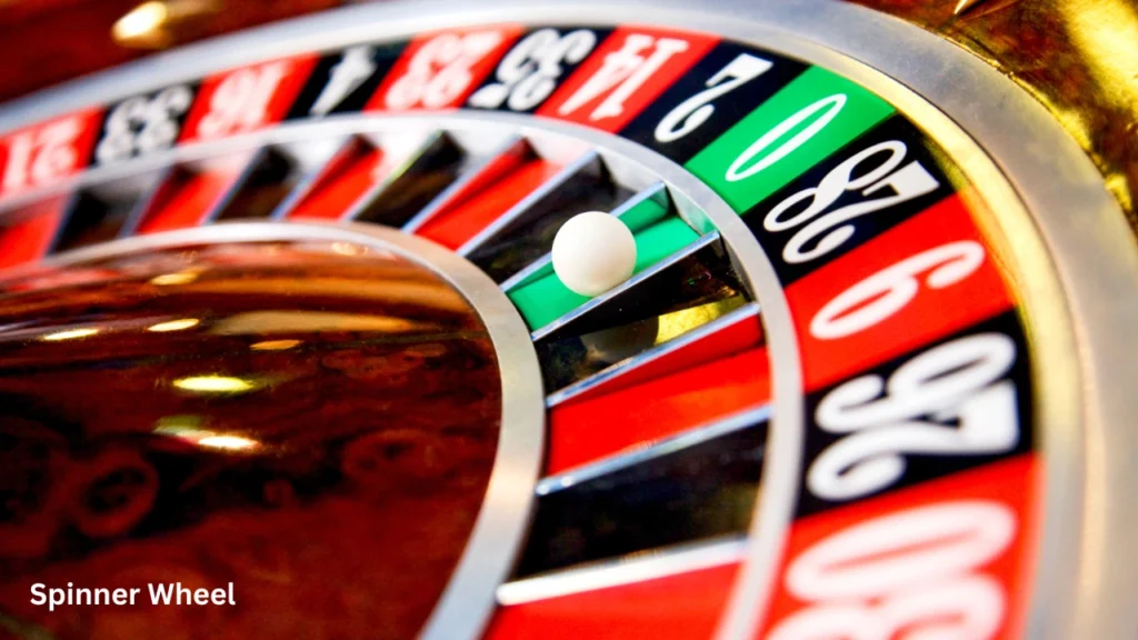A bright green electronic spinner wheel displaying various point values from 20 to 1000 for random selection.